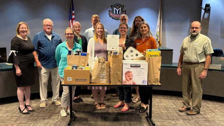 A photo of WayForward Resources employees standing with members of the Middleton Common Council at their meeting on September 16 to officially proclaim September 2025 as Hunger Action Month in Middleton.