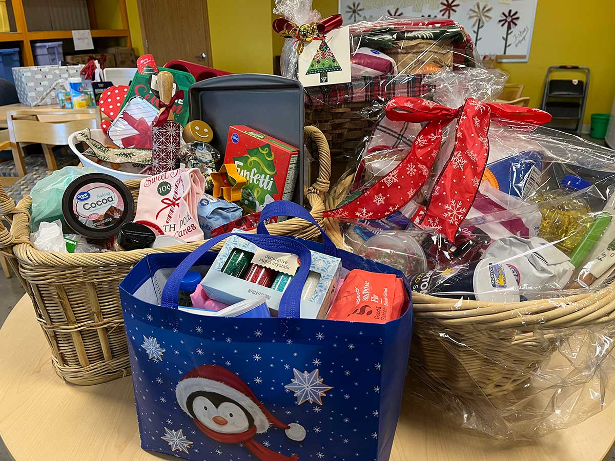 Collection of four baskets gift wrapped with baking items.